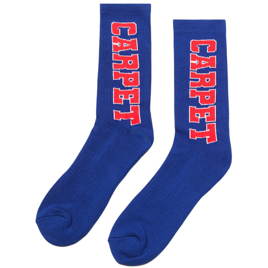 Chaussettes varsity bleues de la marque Carpet, design classique avec rayures blanches et bleu, confortables pour un style sportif.